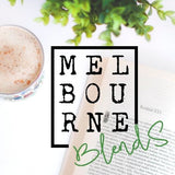 Cup of Freshly made chai latte on table with open book in background with lovely company Melbourne blends company logo