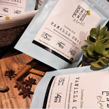 Lactose Free Vanilla Chai Latte packed in 200gr light blue bag with white label position on timber decorated board