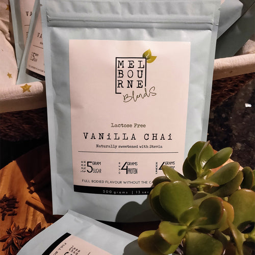 Lactose Free Vanilla Chai Latte packed in 200gr light blue bag with white label position on timber decorated board