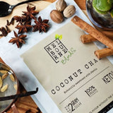 Coconut Chai Latte packed in 200gr white bag with cream label position on timber board Keto approved, 100% Vegan, less than 2 grams of sugar per serve