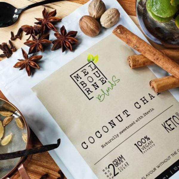 Coconut Chai Latte packed in 200gr white bag with cream label position on timber board Keto approved, 100% Vegan, less than 2 grams of sugar per serve