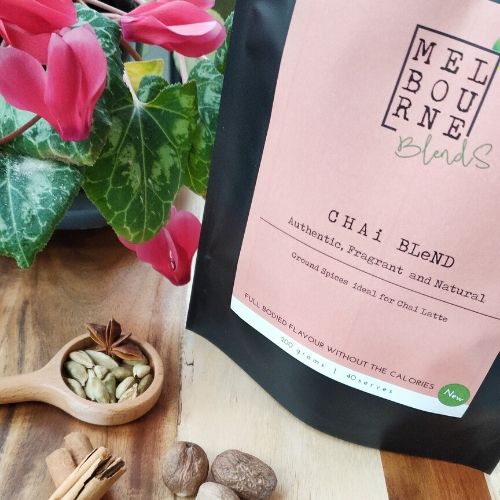 Authentic Chai Spices powder blend, Vegan, Caffeine Free, Lactose Free, Gluten Free, packed in 200gr black bag with pink label position on timber board 