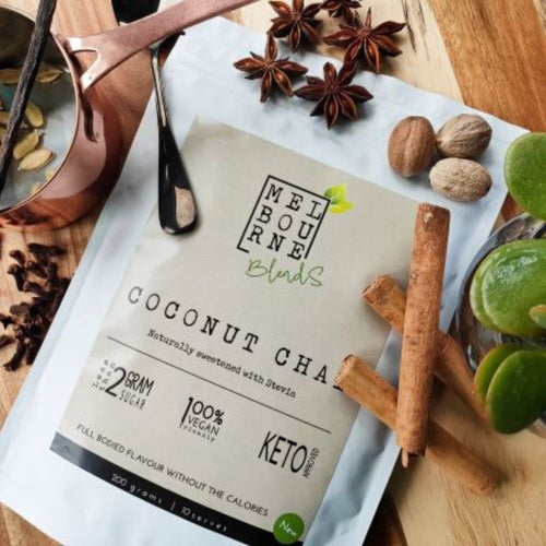 Coconut Chai Latte packed in 200gr white bag with cream label position on timber board Keto approved, 100% Vegan, less than 2 grams of sugar per serve 