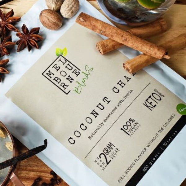 Coconut Chai Latte packed in 200gr white bag with cream label position on timber board Keto approved, 100% Vegan, less than 2 grams of sugar per serve 